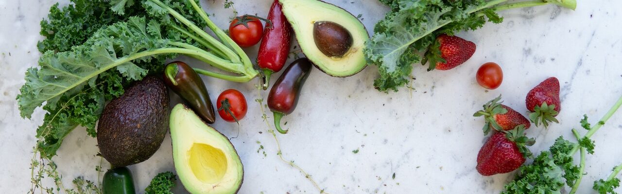 picture of kale, avacados, and strawberries representing superfood