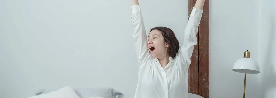 Woman stretching after waking up.