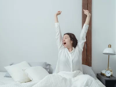 Woman stretching after waking up.