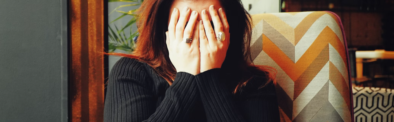 Woman experiencing a headache.