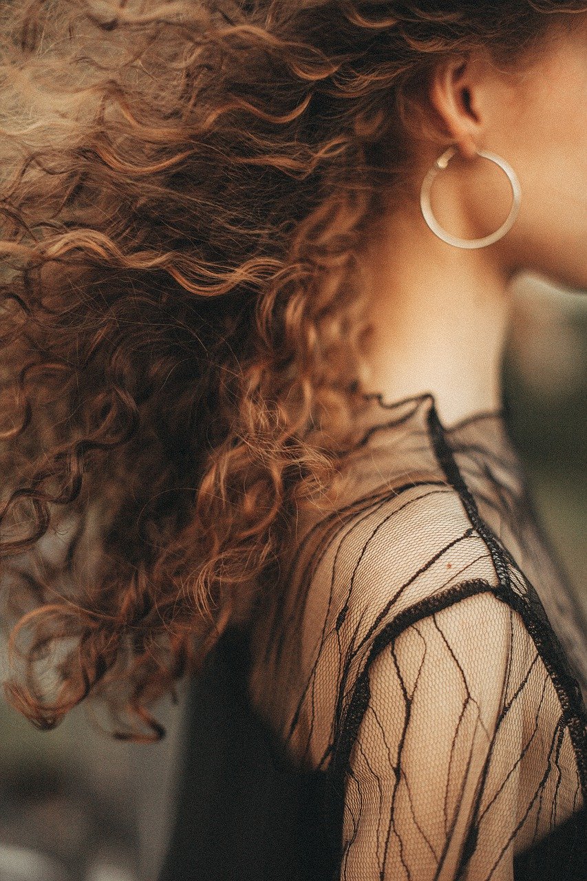 A girl with curly hair.