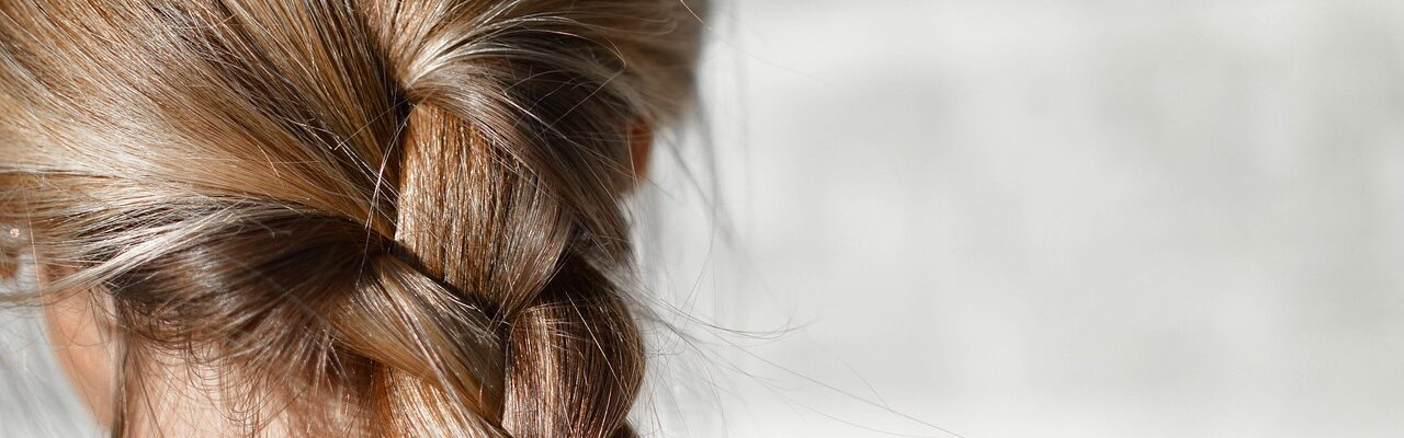 A woman's hair in a braid.